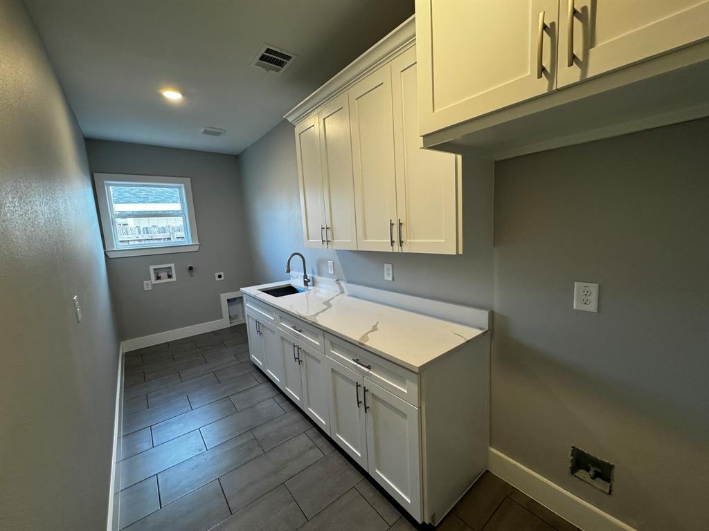 2533 Jonesboro Avenue Dallas, TX 75228 - Photo 23 of 27 a bathroom with a granite countertop sink and a bathtub