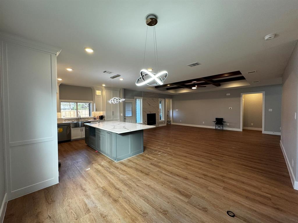 2533 Jonesboro Avenue Dallas, TX 75228 - Photo 5 of 27 a large kitchen with a large counter top a sink a window and stainless steel appliances