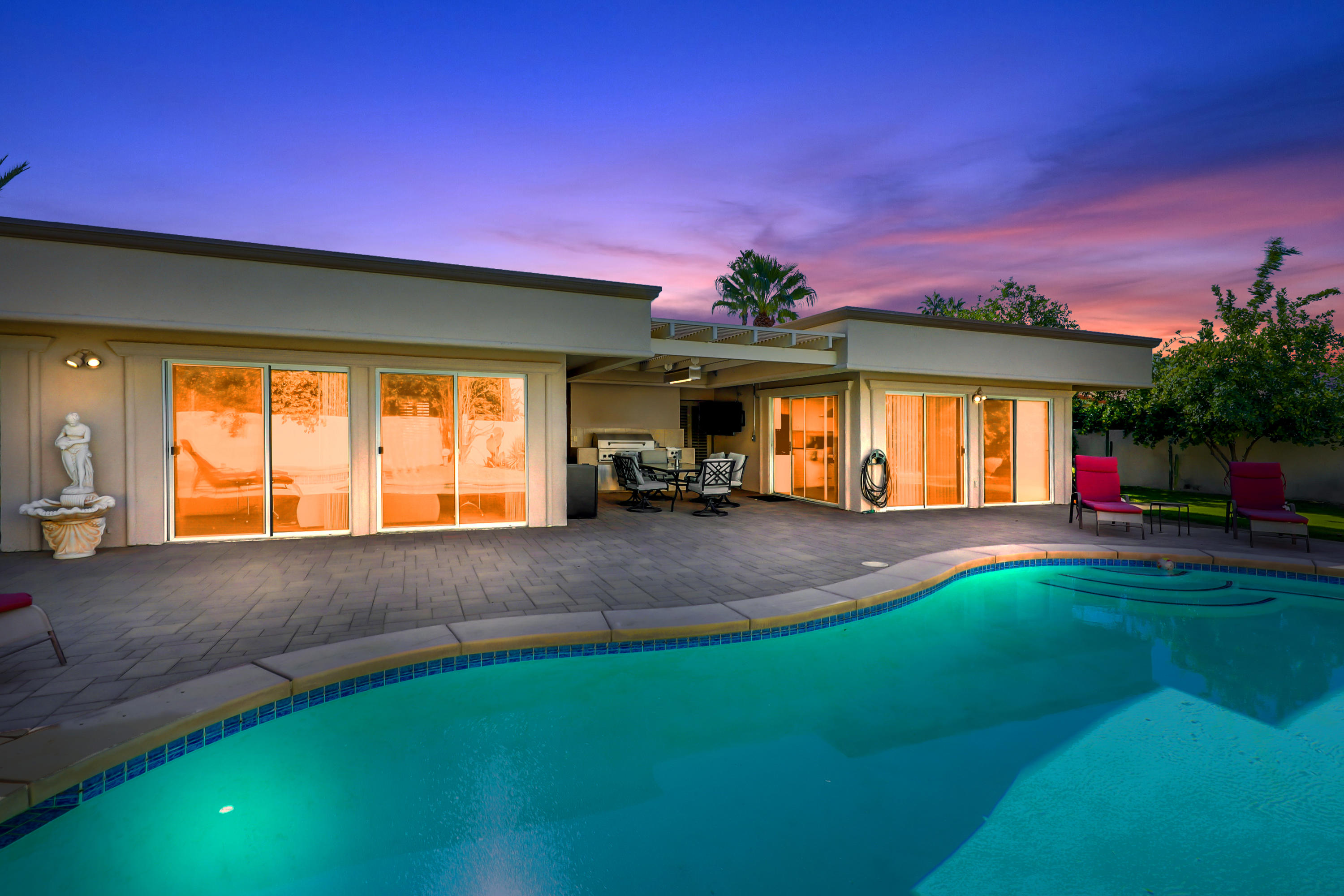 a front view of a house with a yard and a yard