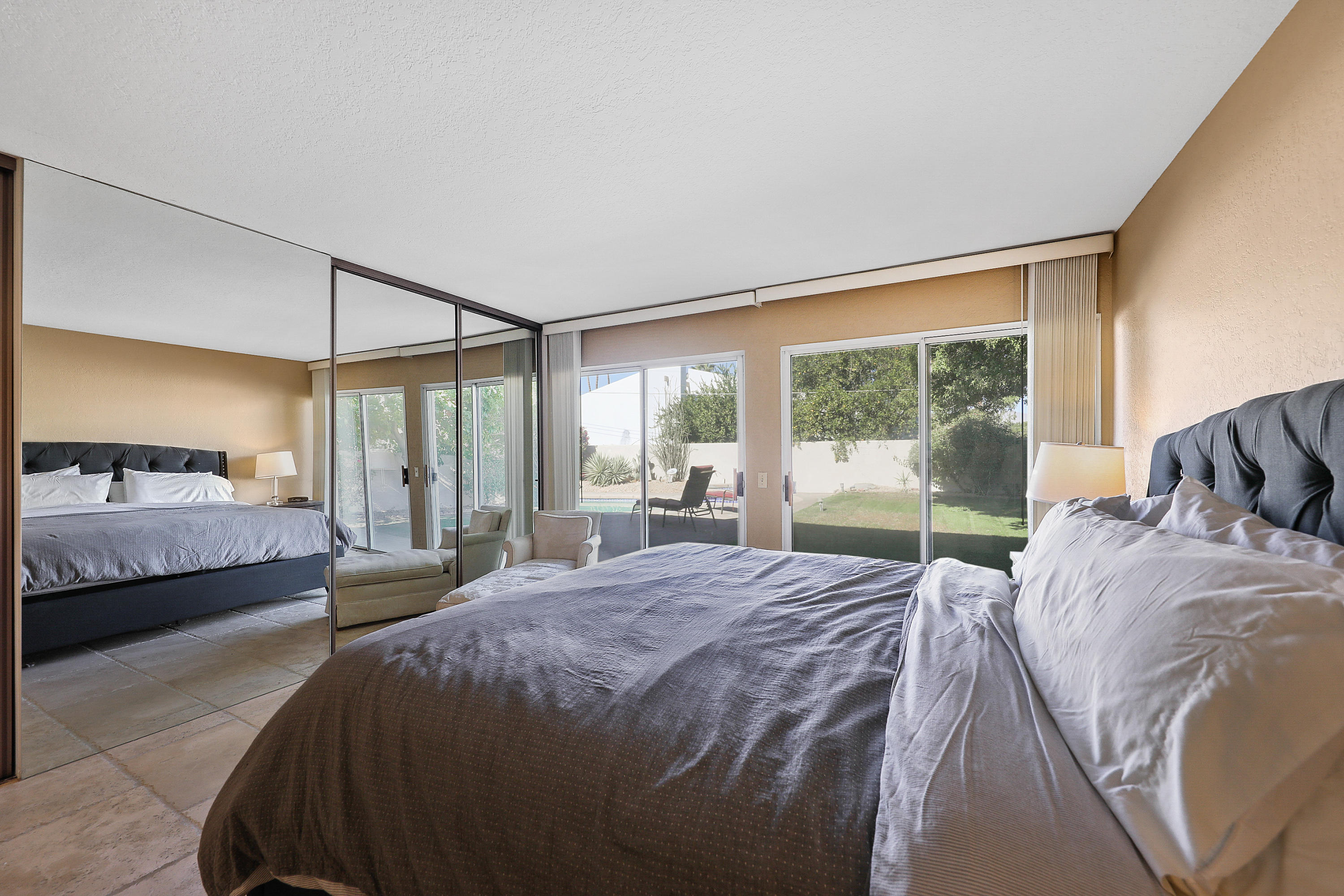 78950 Starlight Lane Bermuda Dunes, CA 92203 - Photo 16 of 32 a large bedroom with a bed and large window