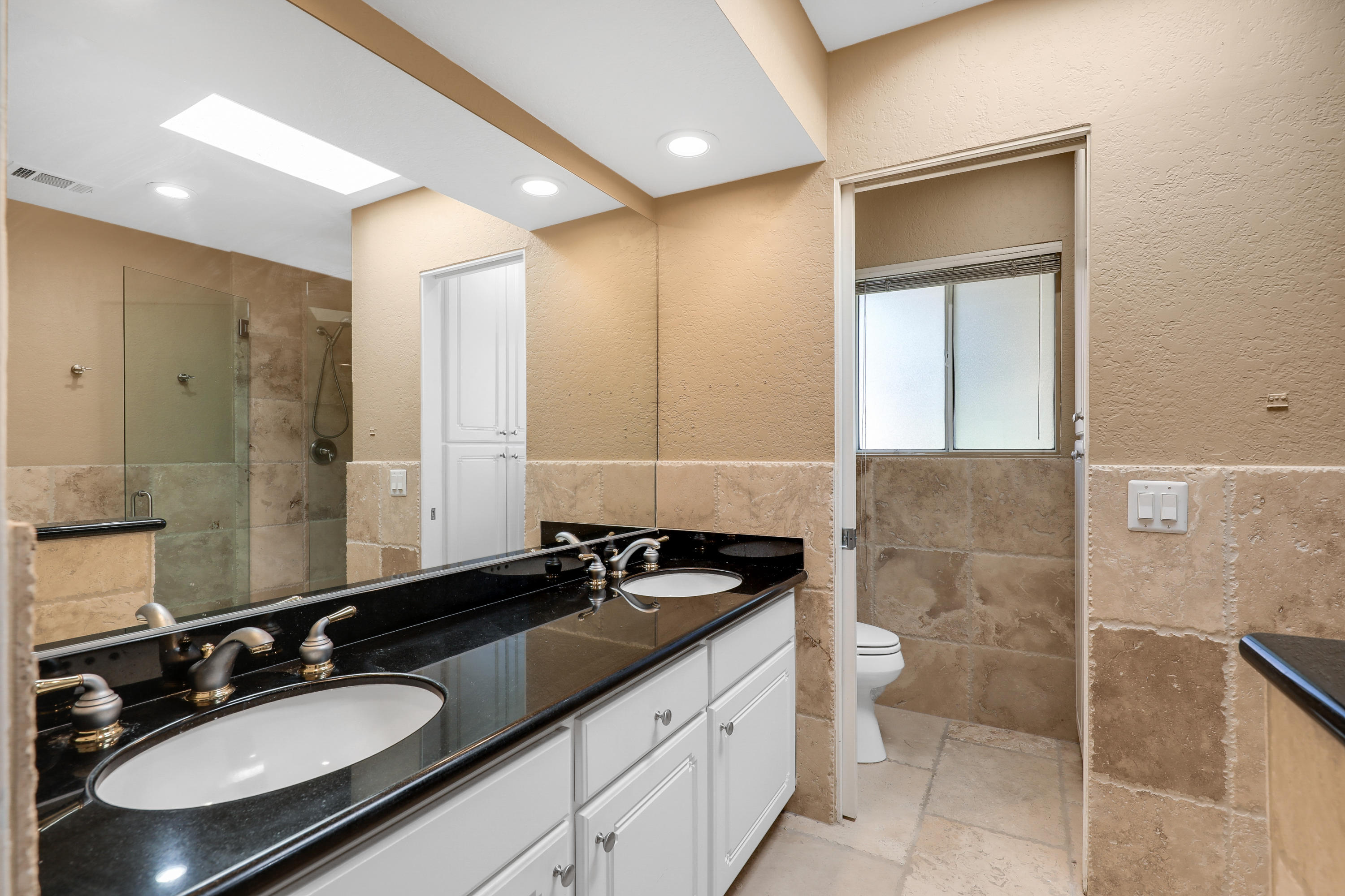 78950 Starlight Lane Bermuda Dunes, CA 92203 - Photo 17 of 32 a bathroom with a sink and a mirror