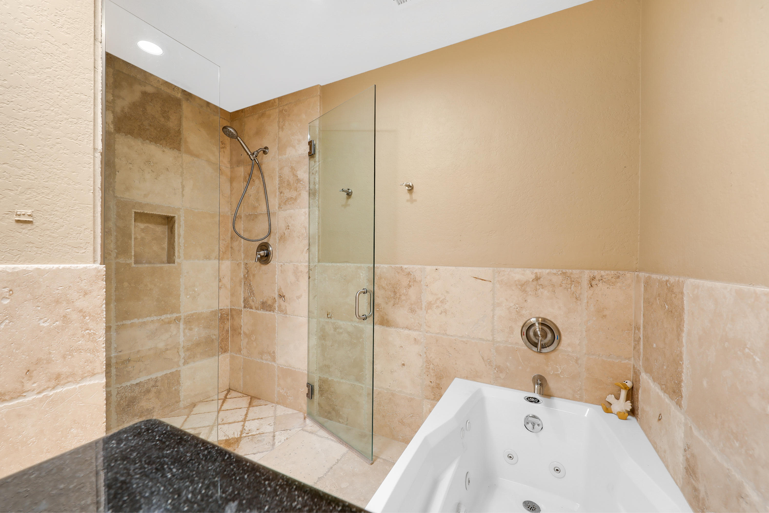 78950 Starlight Lane Bermuda Dunes, CA 92203 - Photo 18 of 32 a bathroom with a bathtub and shower