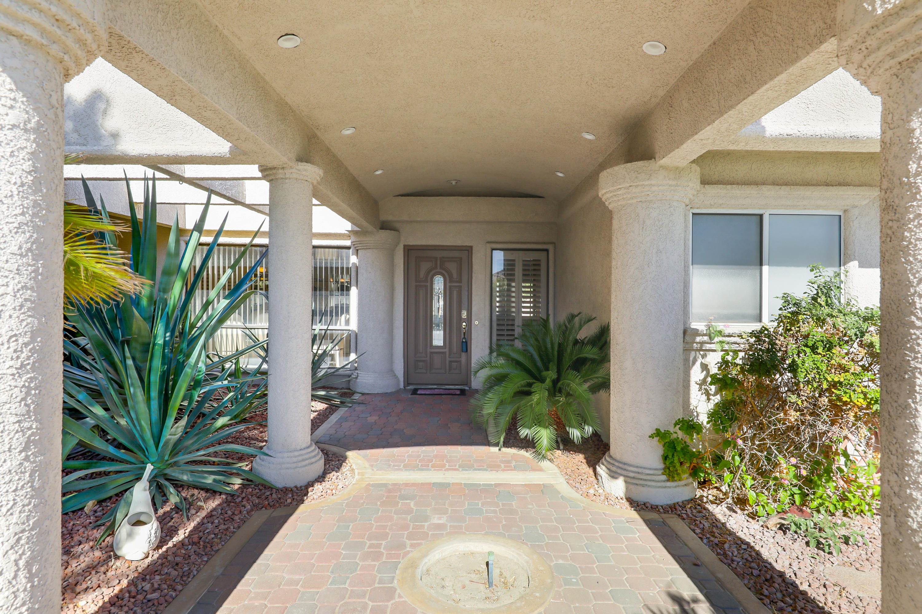 78950 Starlight Lane Bermuda Dunes, CA 92203 - Photo 3 of 32 a potted plant sitting in front of a house