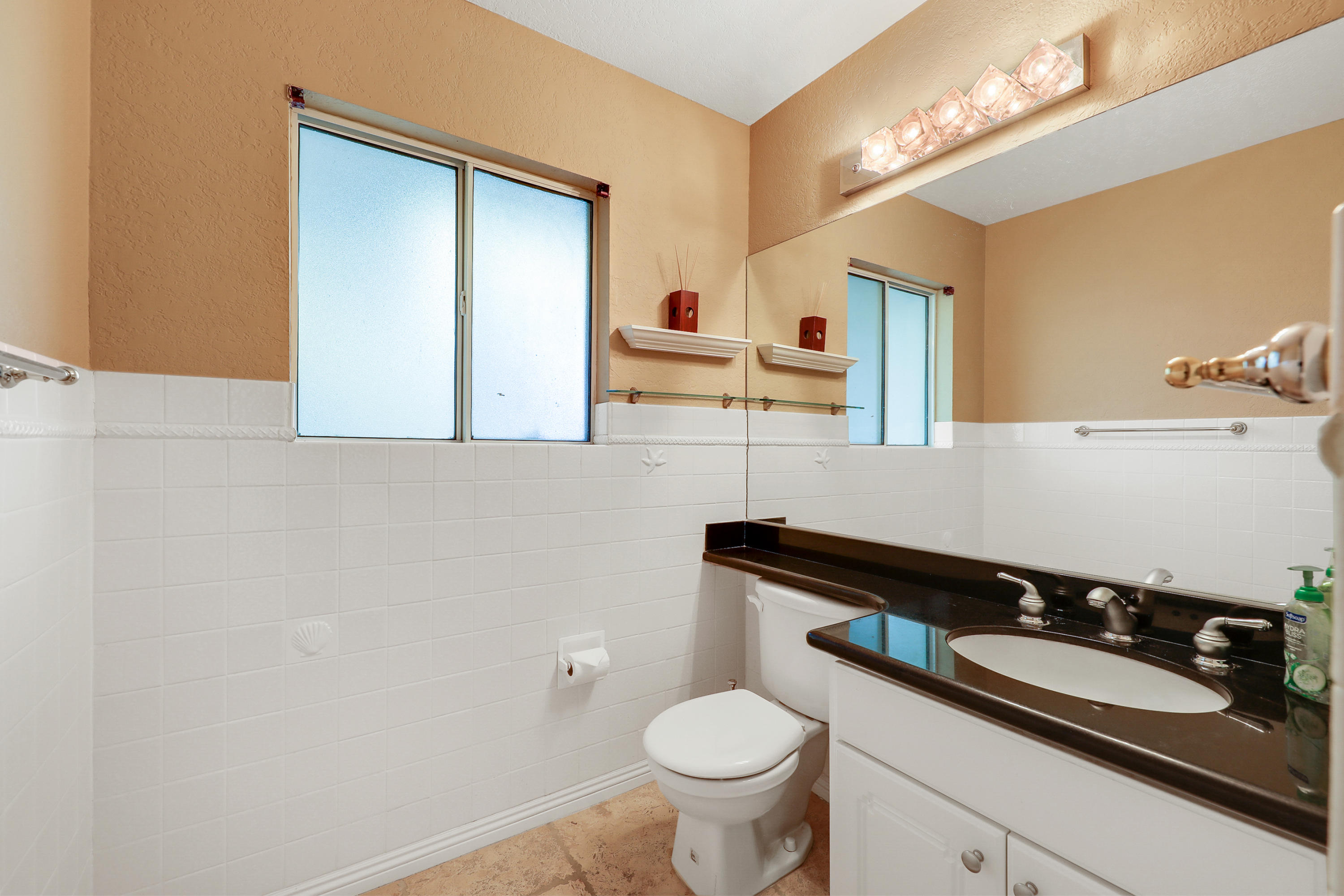 78950 Starlight Lane Bermuda Dunes, CA 92203 - Photo 21 of 32 a bathroom with a sink and a mirror