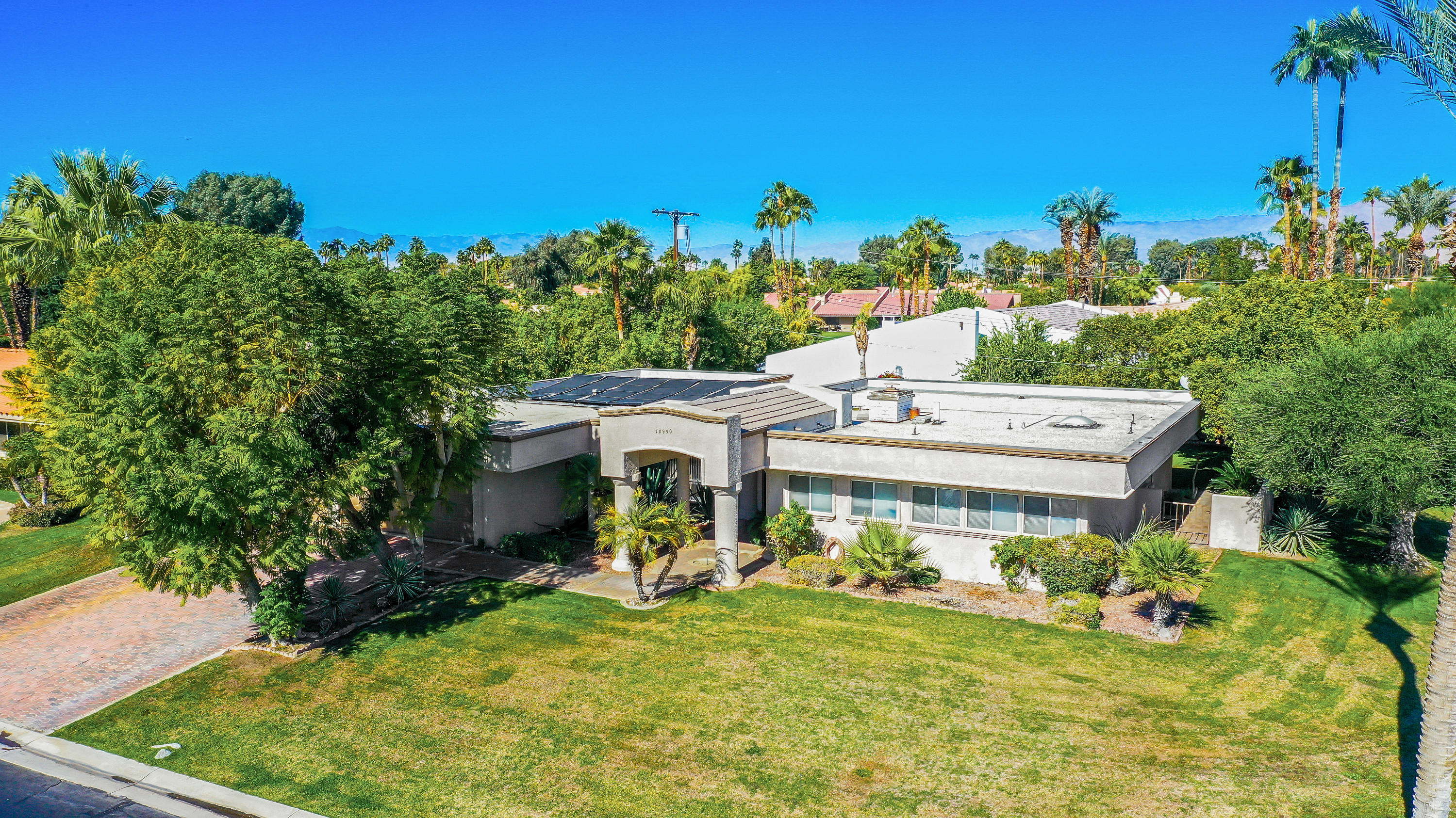 78950 Starlight Lane Bermuda Dunes, CA 92203 - Photo 23 of 32 a front view of a house with a yard