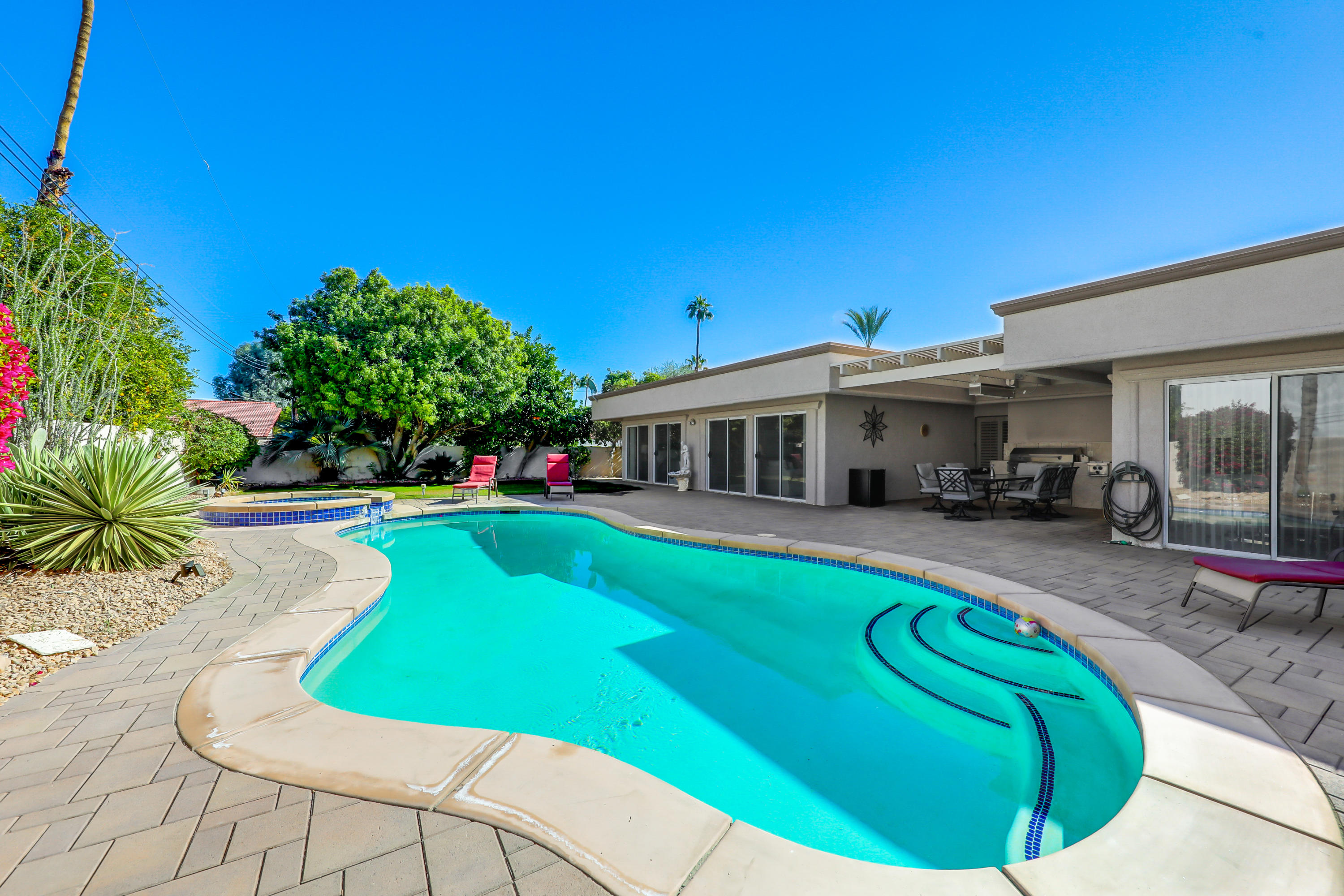 78950 Starlight Lane Bermuda Dunes, CA 92203 - Photo 28 of 32 a view of a house with backyard swimming pool and sitting area