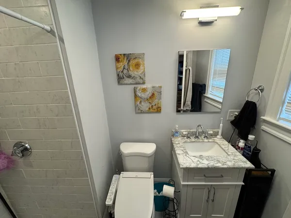 a view of kitchen island with furniture and wooden floor