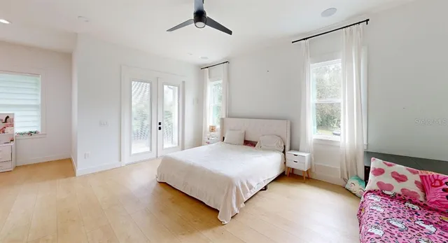 a bedroom with a bed and a window