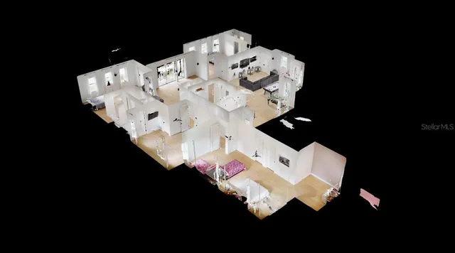 a bed sitting in a bedroom next to a lamp