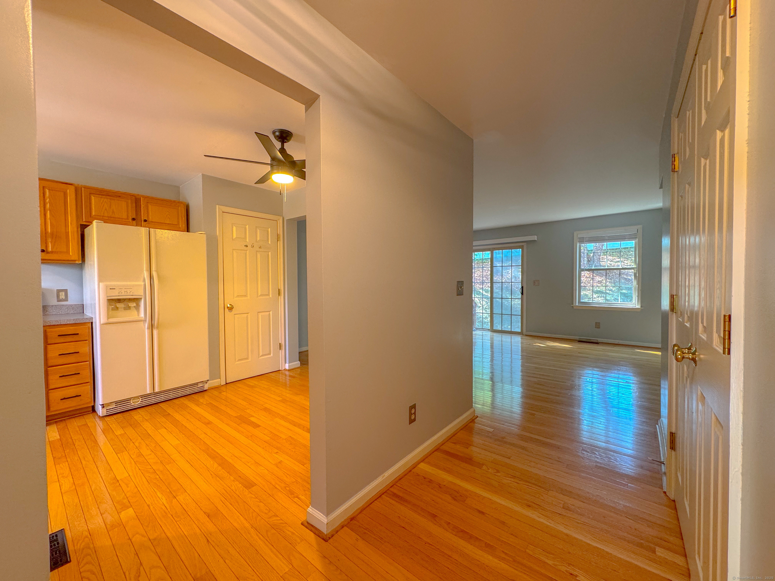 19 Hawthorne Drive, Unit 102 New London, CT 06320 - Photo 12 of 33 wooden floor in an empty room with a window