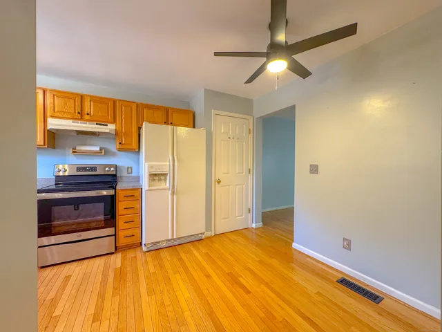 a view of kitchen and wooden floor