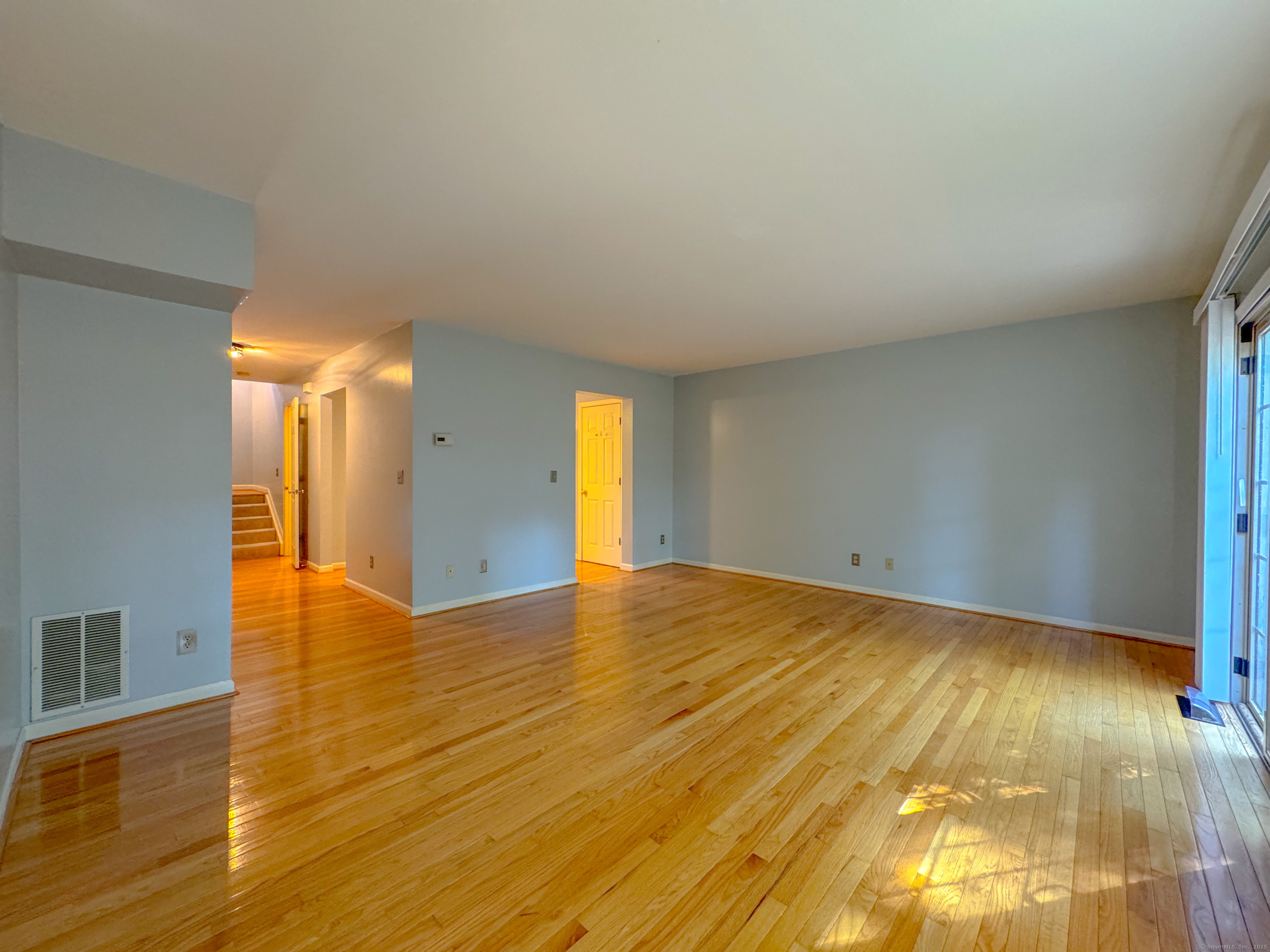 19 Hawthorne Drive, Unit 102 New London, CT 06320 - Photo 18 of 33 a view of empty room with wooden floor