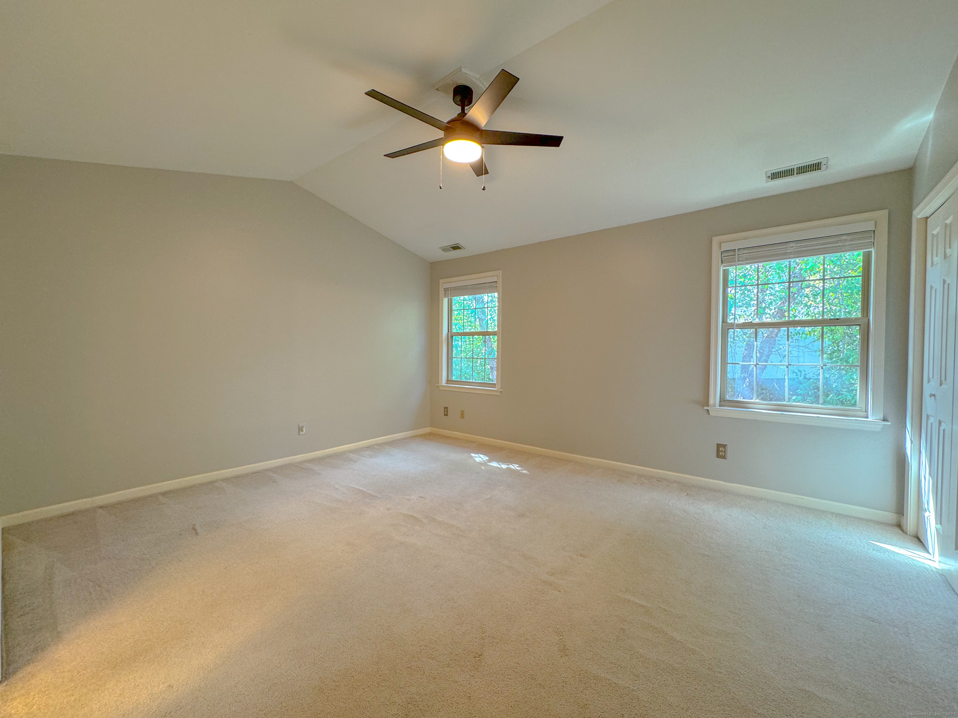19 Hawthorne Drive, Unit 102 New London, CT 06320 - Photo 25 of 33 an empty room with ceiling fan and window