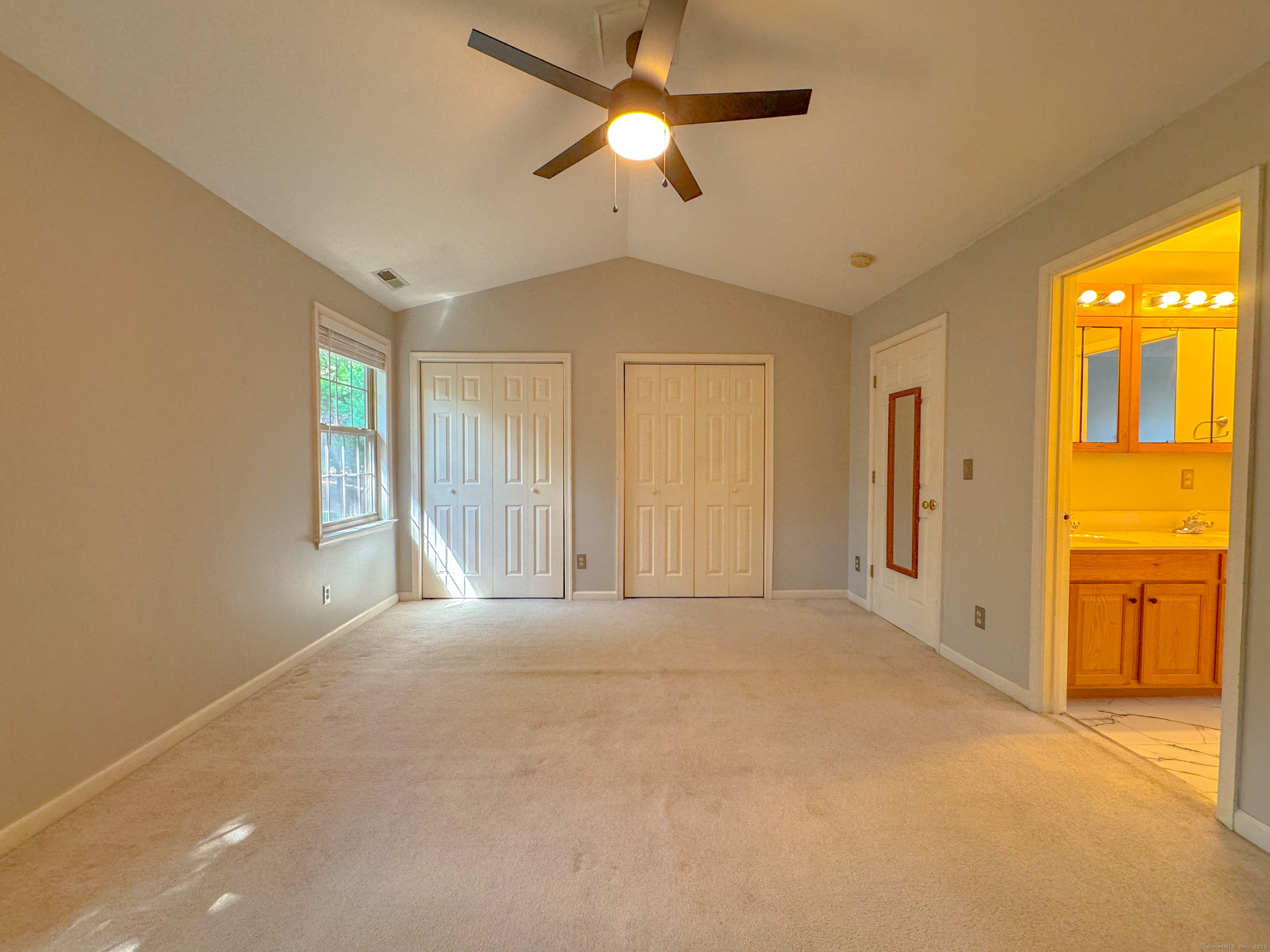 19 Hawthorne Drive, Unit 102 New London, CT 06320 - Photo 26 of 33 a view of an empty room with window and cabinet