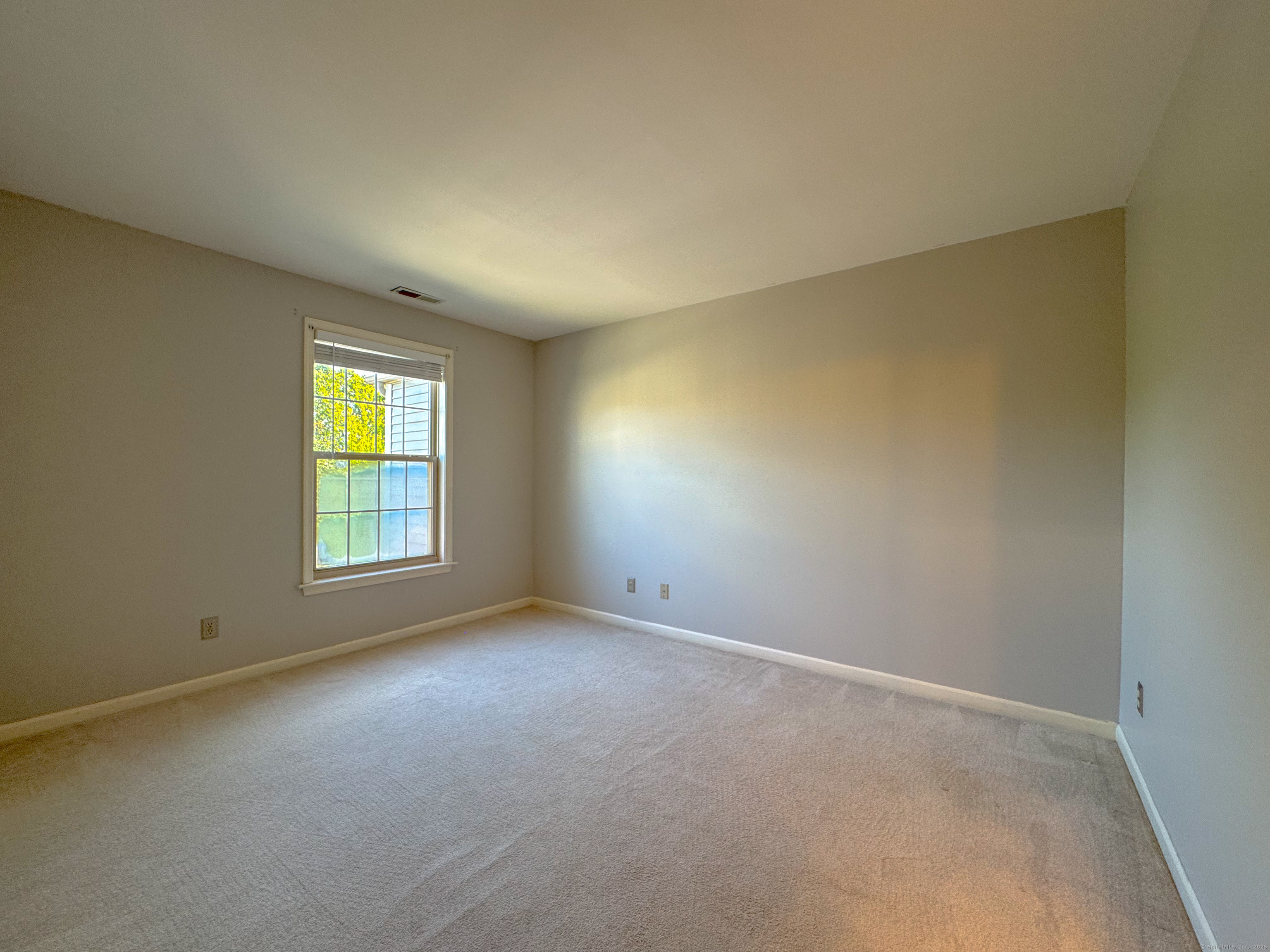 19 Hawthorne Drive, Unit 102 New London, CT 06320 - Photo 30 of 33 an empty room with windows