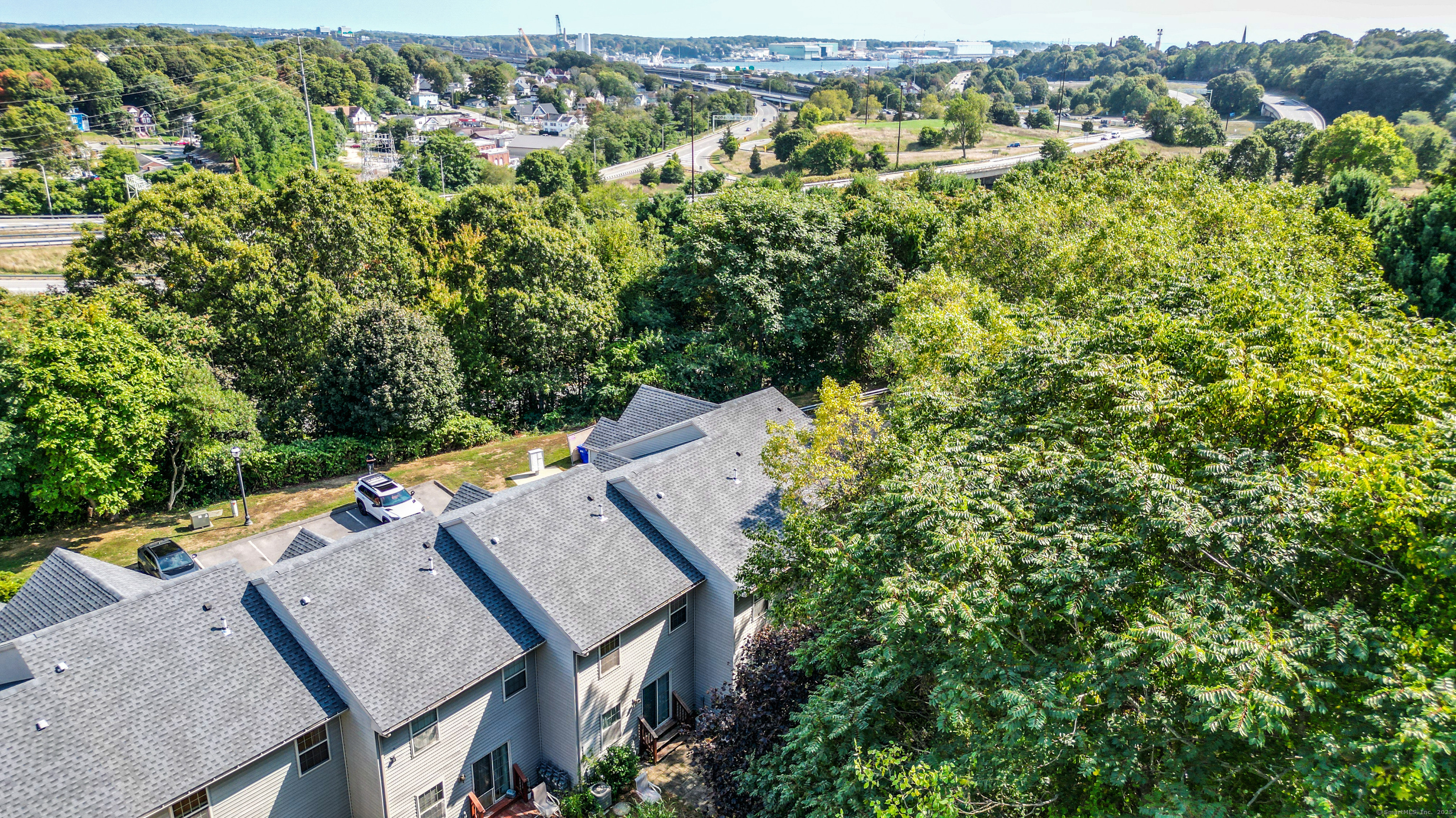 19 Hawthorne Drive, Unit 102 New London, CT 06320 - Photo 6 of 33 an aerial view of a house with a yard