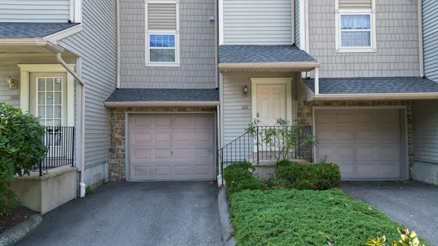 a front view of a house with garage