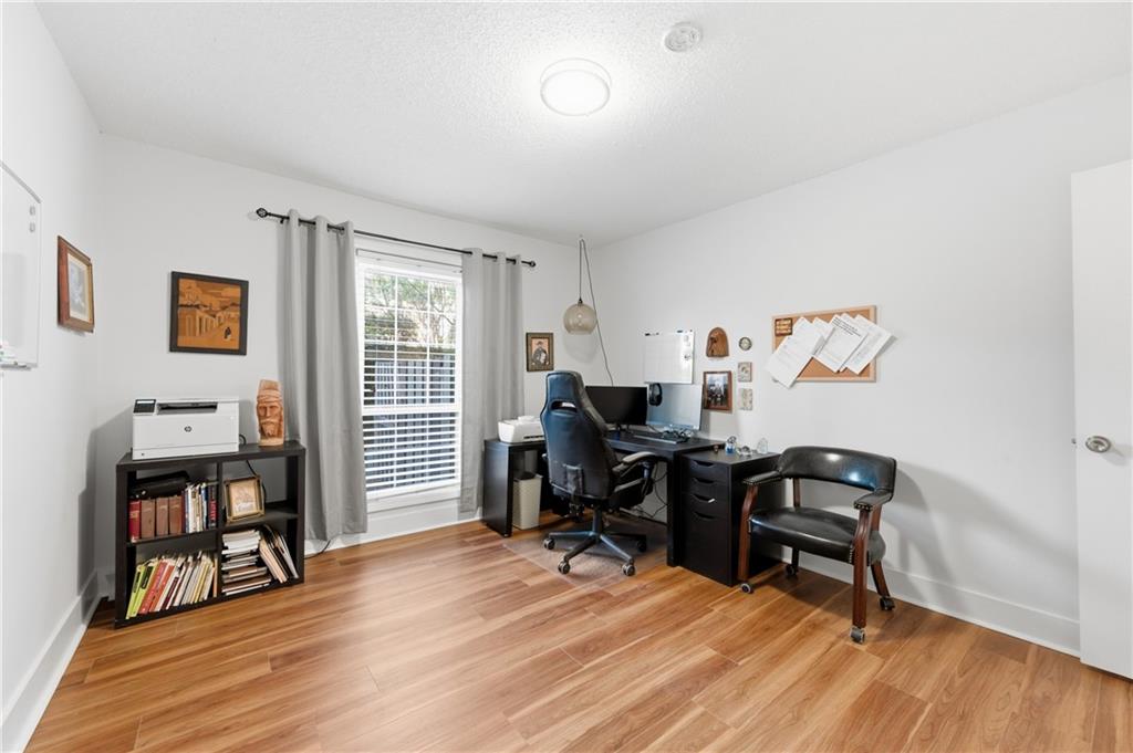 6851 Roswell Road, Unit F15 Atlanta, GA 30328 - Photo 19 of 31 a view of a workspace with furniture and a window