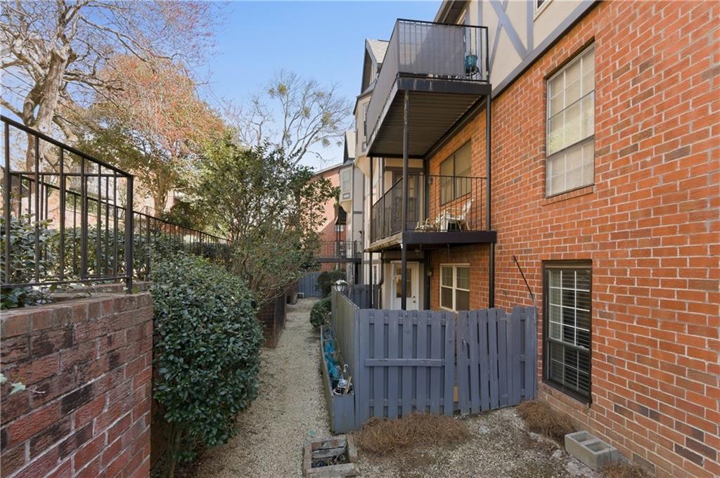 6851 Roswell Road, Unit F15 Atlanta, GA 30328 - Photo 26 of 31 a view of a house with brick walls