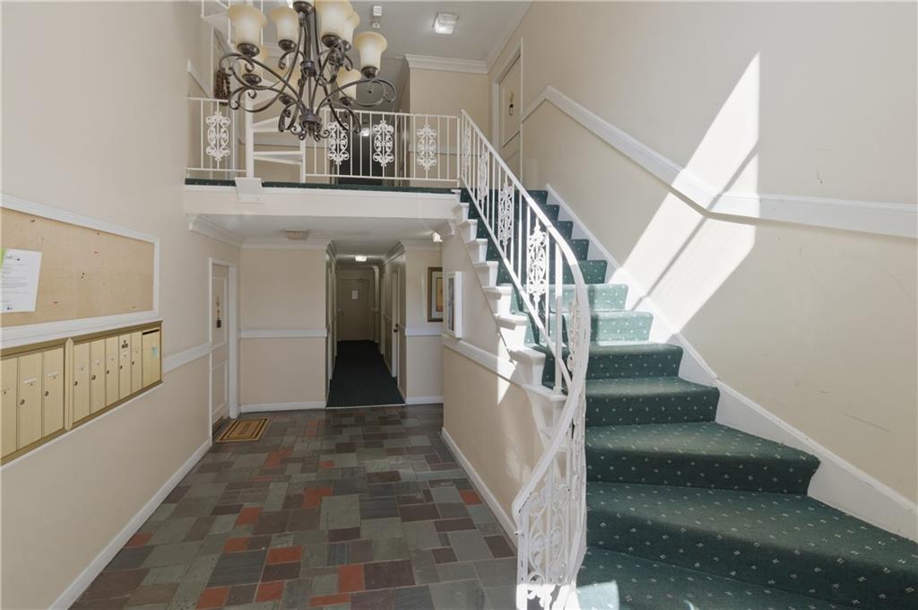 6851 Roswell Road, Unit F15 Atlanta, GA 30328 - Photo 29 of 31 a view of entryway and hall with wooden floor