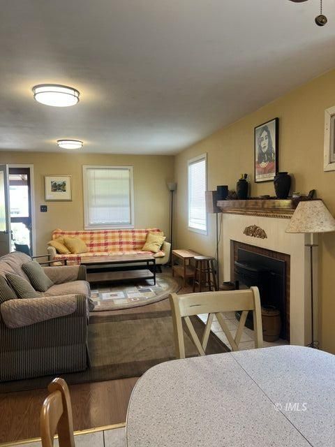 103 North Clay Street Independence, CA 93526 - Photo 10 of 25 a living room with furniture and a fireplace