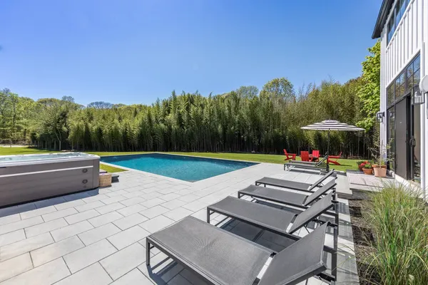 a view of a swimming pool with a patio