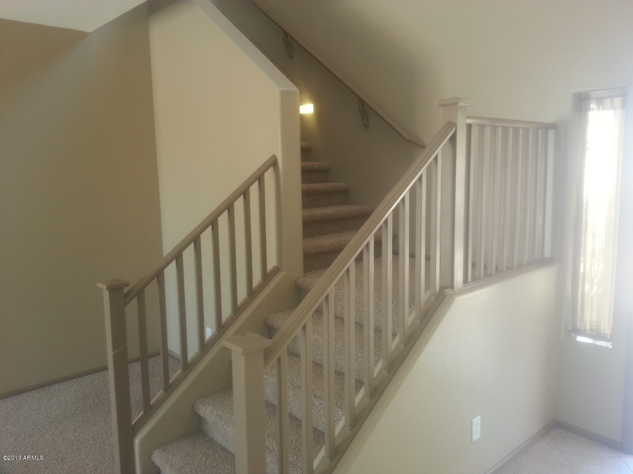 44395 Cypress Lane Maricopa, AZ 85138 - Photo 12 of 20 a view of staircase with railing and white walls