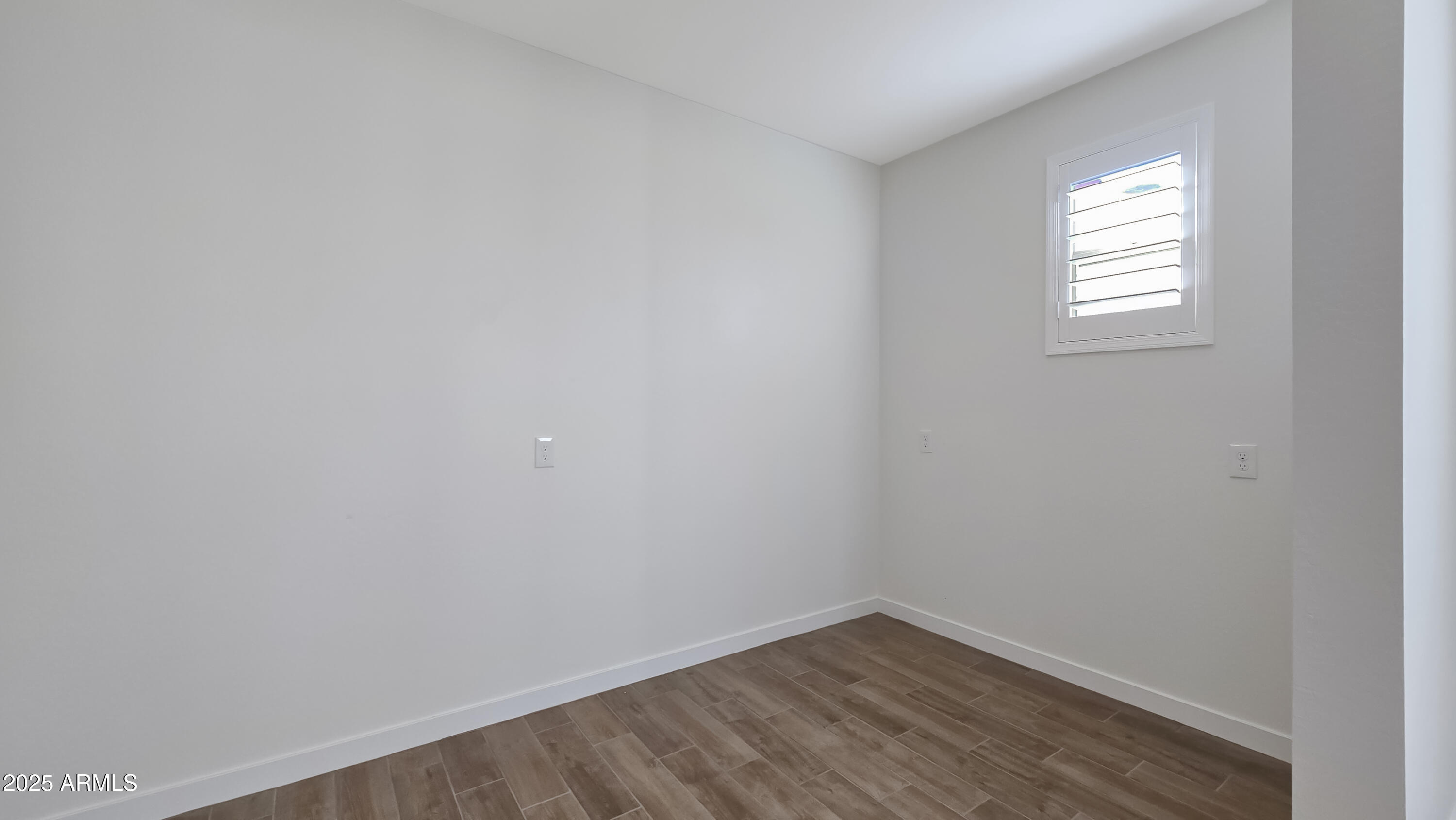 17864 West Thistle Landing Drive Goodyear, AZ 85338 - Photo 12 of 43 a view of an empty room and window