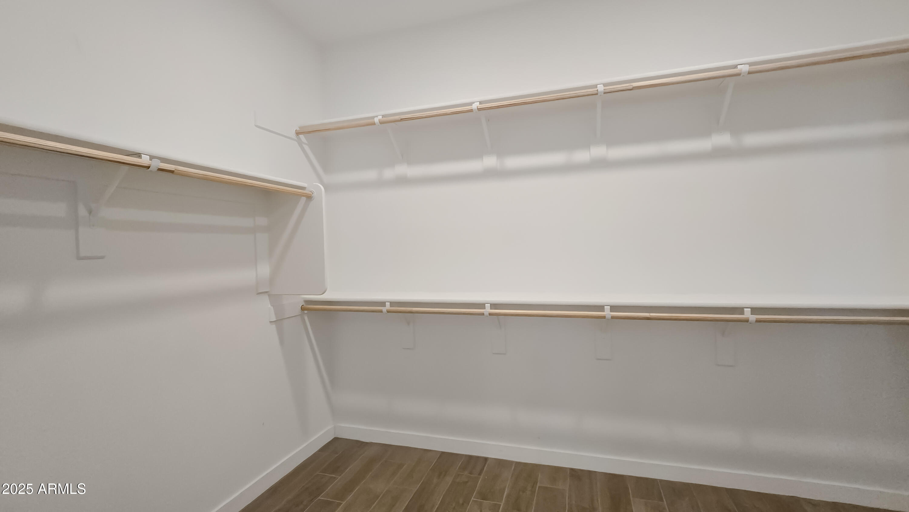 17864 West Thistle Landing Drive Goodyear, AZ 85338 - Photo 21 of 43 a view of an empty walk in closet