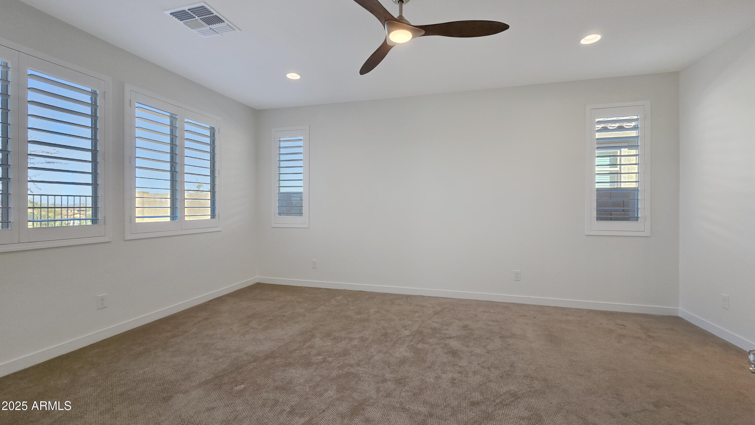 17864 West Thistle Landing Drive Goodyear, AZ 85338 - Photo 22 of 43 an empty room with windows
