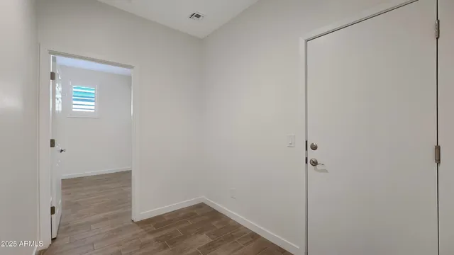 a view of small space with wooden floor