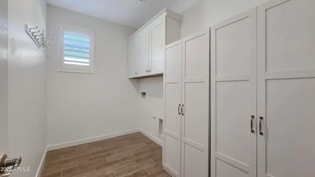 a view of room with hardwood floor and window