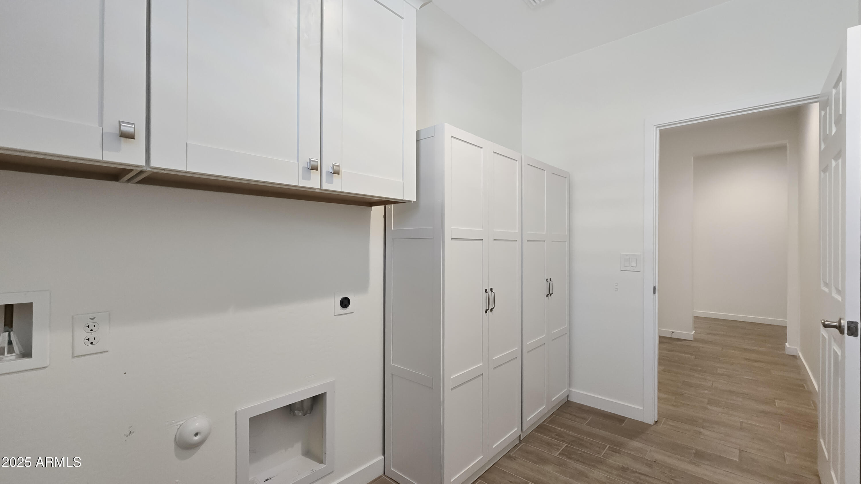 17864 West Thistle Landing Drive Goodyear, AZ 85338 - Photo 25 of 43 a view of room with hardwood floor