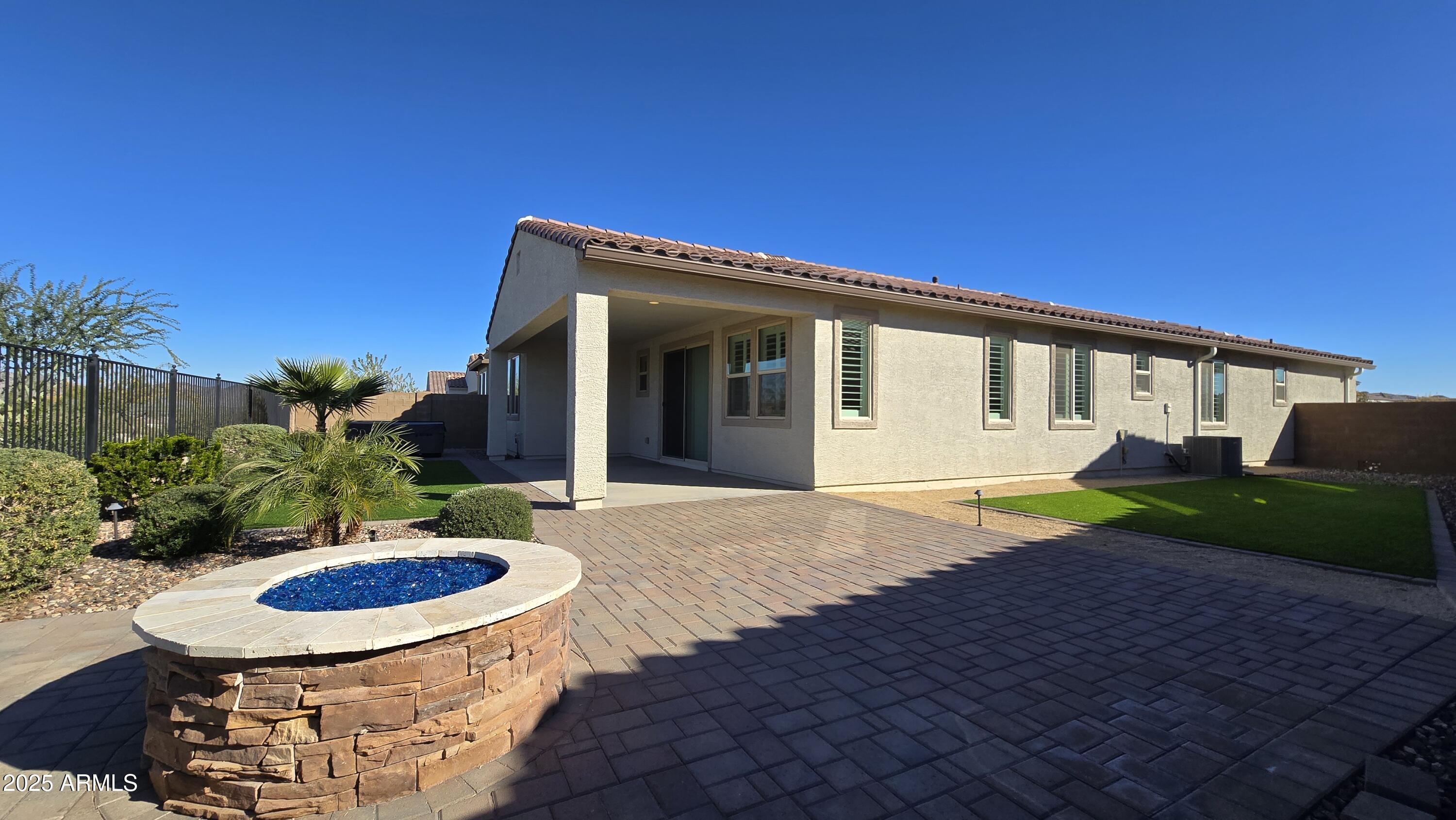 17864 West Thistle Landing Drive Goodyear, AZ 85338 - Photo 27 of 43 a view of an house with backyard space and garden