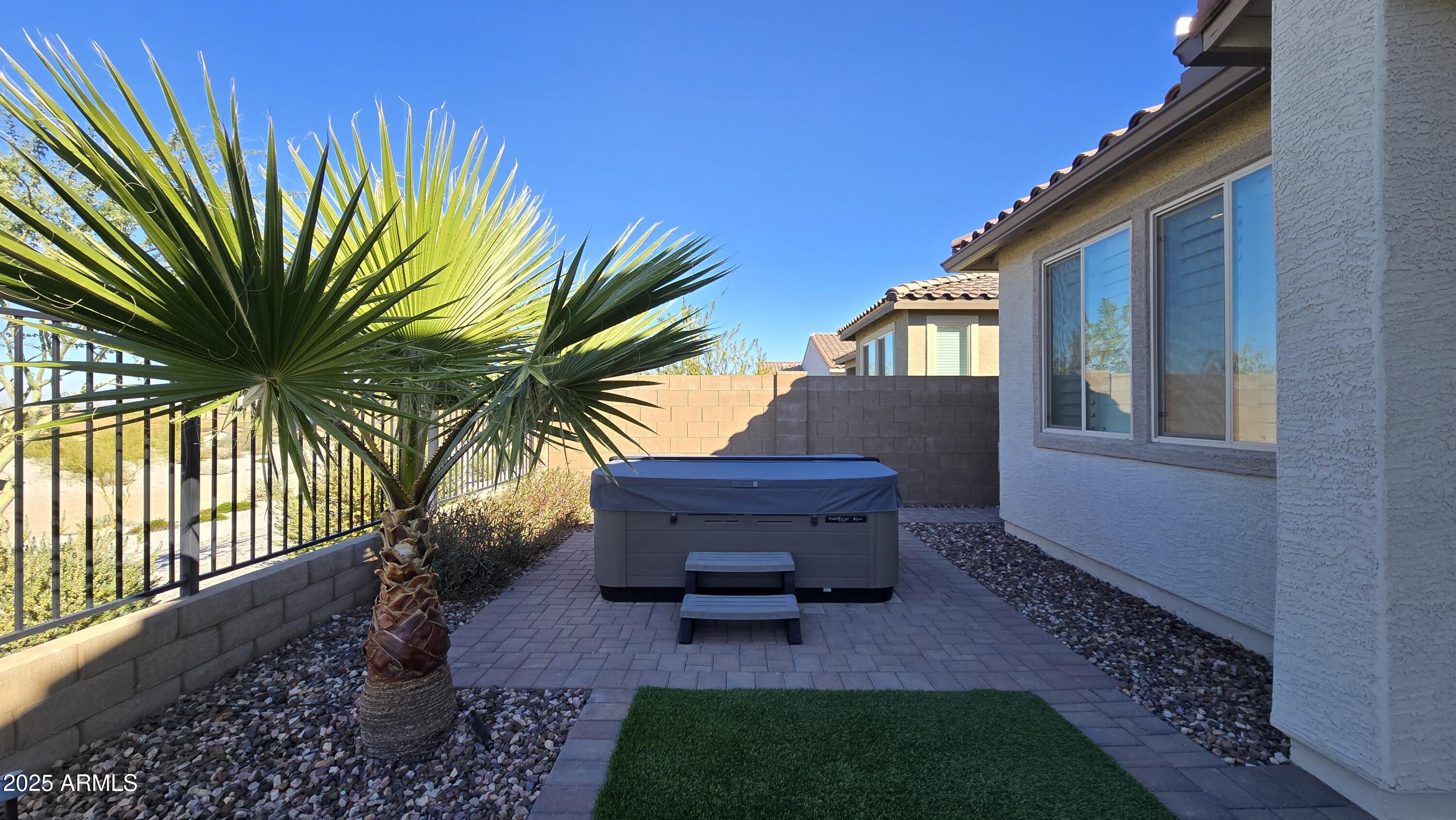 17864 West Thistle Landing Drive Goodyear, AZ 85338 - Photo 30 of 43 a backyard of a house with seating space