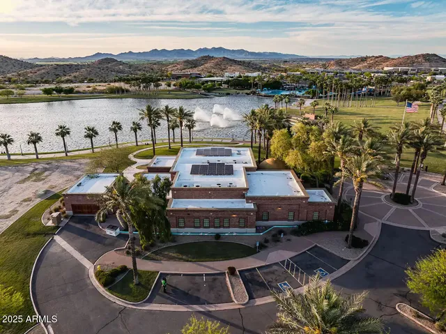 a view of a lake with a house in the background