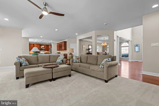 a bedroom with furniture and large window