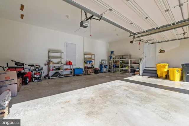 a spacious bathroom with a tub sink and mirror