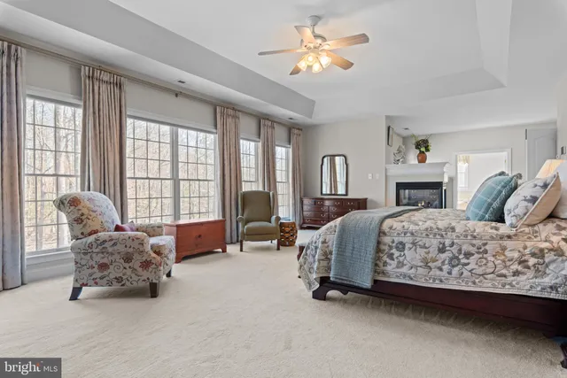 a bedroom with a bed chair and a window