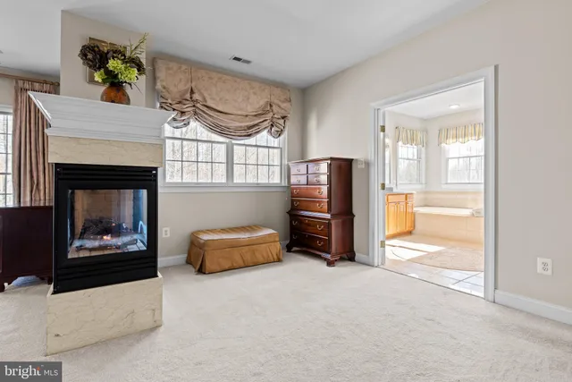 a bedroom with a bed lamp and window