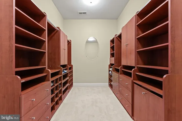 a spacious bedroom with a bed and a window