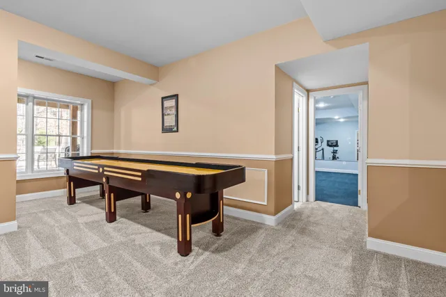 a front view of a house with yard and green space