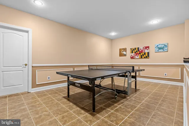 a view of a yard with plants and large trees