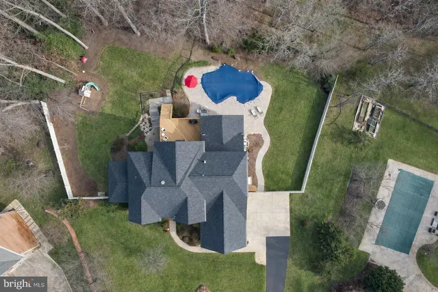 a view of main area with wooden floor staircase and a living room