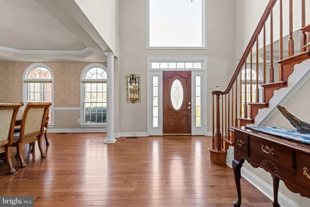a living room with furniture window and wooden floor
