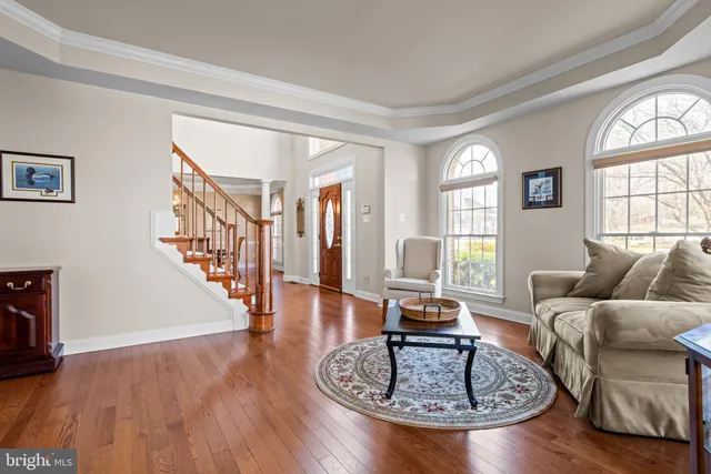 a bed sitting in a bedroom next to a large window