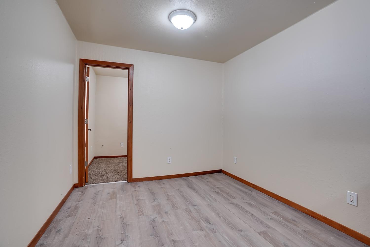 607 Mountain Ranch Road, Unit 2 San Andreas, CA 95249 - Photo 11 of 16 a view of an empty room with wooden floor and closet