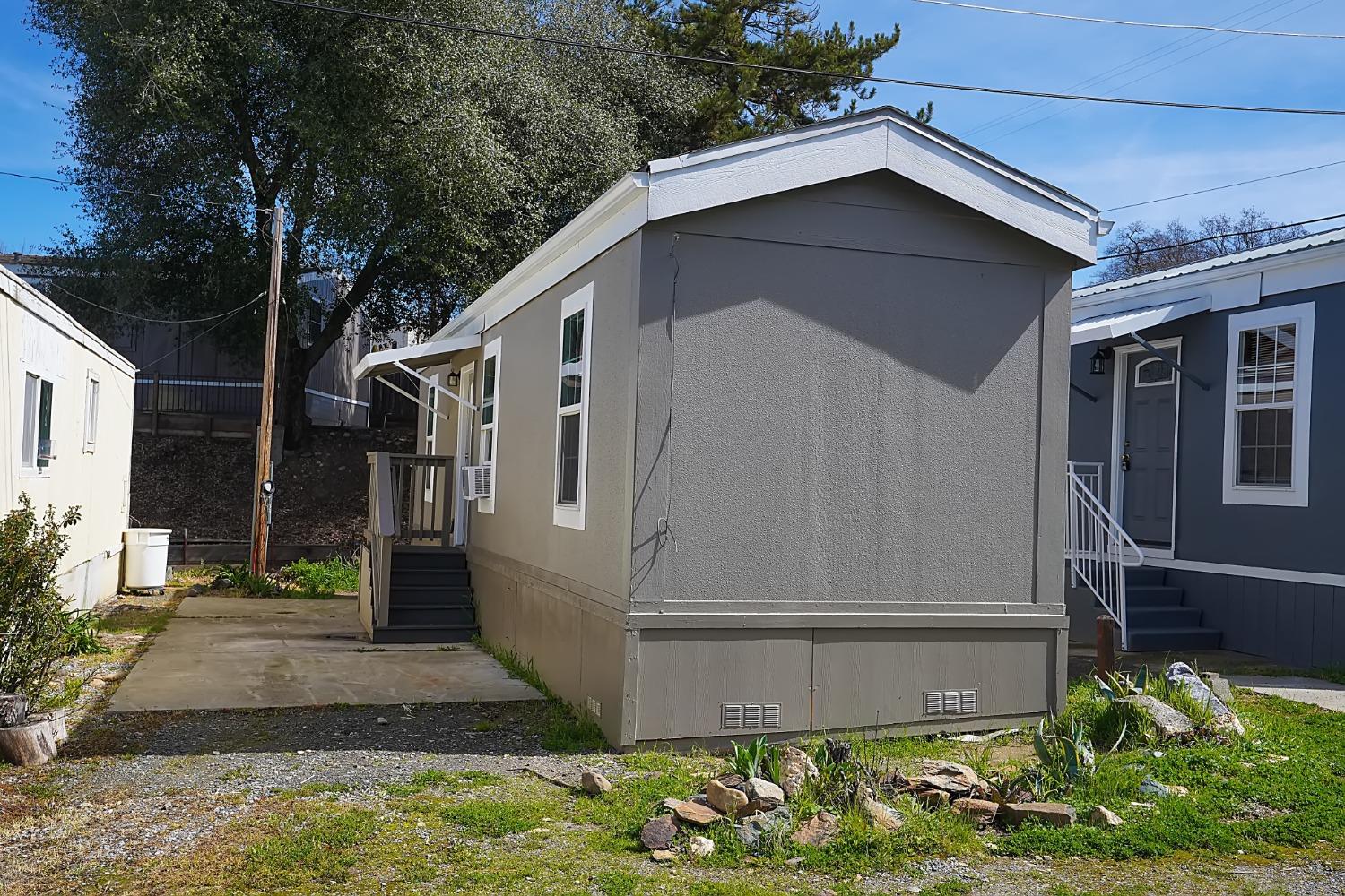 607 Mountain Ranch Road, Unit 2 San Andreas, CA 95249 - Photo 2 of 16 a front view of a house with garden