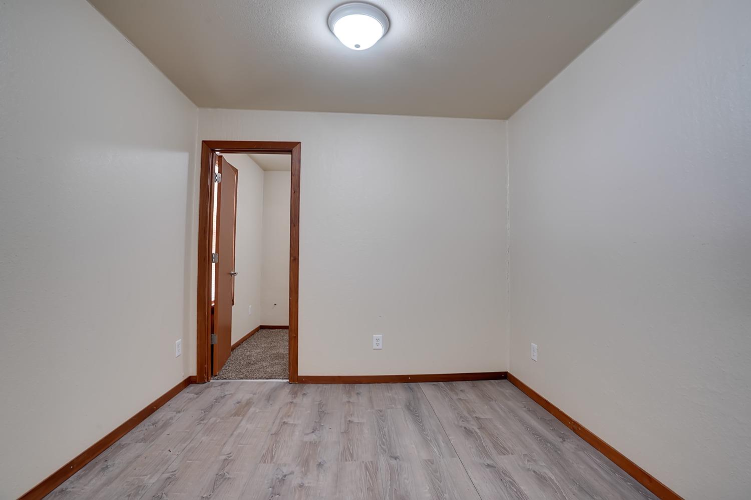607 Mountain Ranch Road, Unit 2 San Andreas, CA 95249 - Photo 5 of 16 a view of an empty room and wooden floor