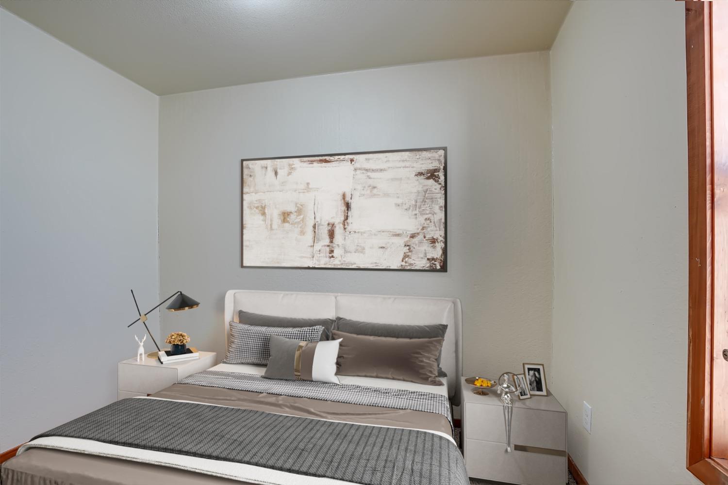 607 Mountain Ranch Road, Unit 2 San Andreas, CA 95249 - Photo 9 of 16 a bedroom with a bed and wall painting